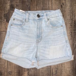 high waisted, light wash shorts.